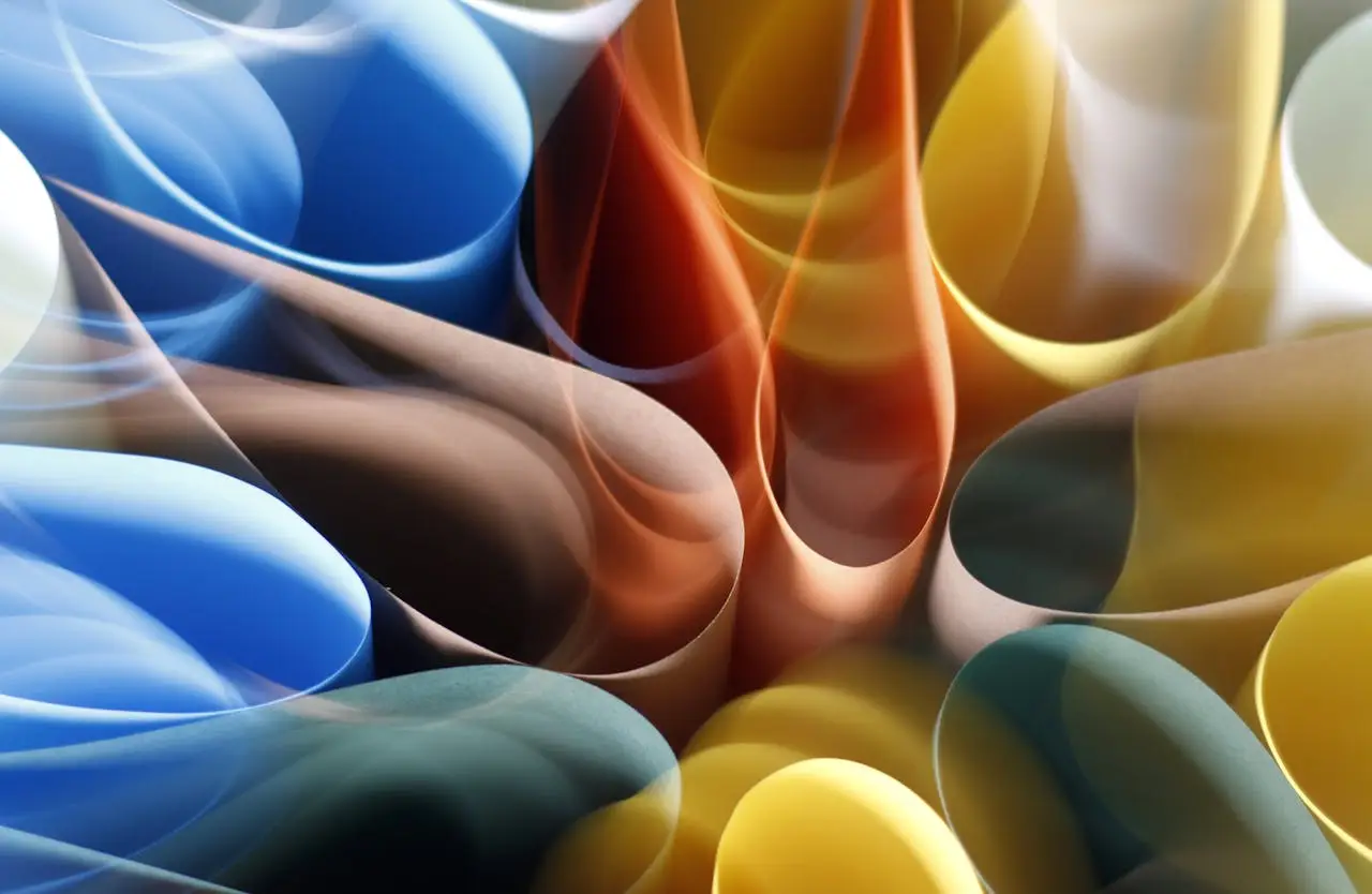 Dynamic abstract composition of colorful paper rolls creating a vibrant visual pattern.