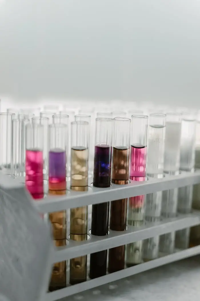 gallery-2 Close-up of colorful chemical solutions in test tubes, arranged in a rack for scientific analysis.